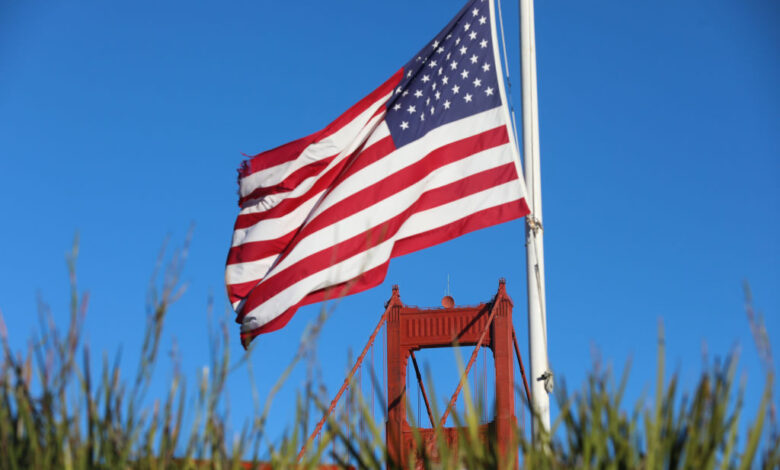 An American flag near the Golden Gate Bridge in San Francisco, California.