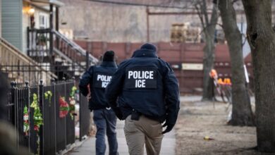 US Immigration and Customs Enforcement (ICE) agents walk down a street during a multi-agency targeted enforcement operation in Chicago, Illinois, US, on Sunday, Jan. 26, 2025.